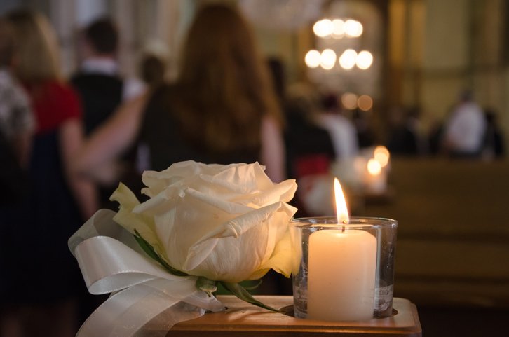 rose-and-candle-at-a-memorial-service